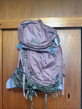 REI womens traverse 65 mauve hiking backpack with teal accents